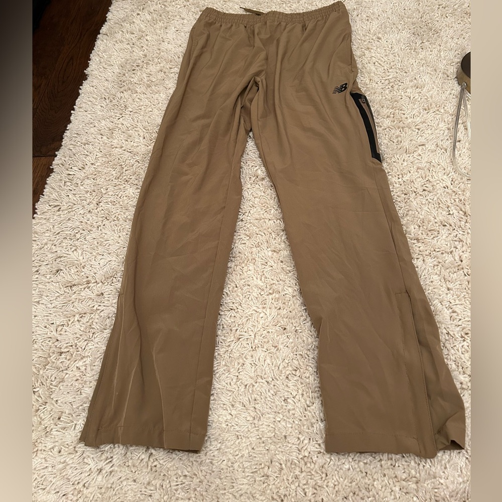 NEW BALANCE  Mens Running Pants Size L. Drawstring waist with zip along ankle.